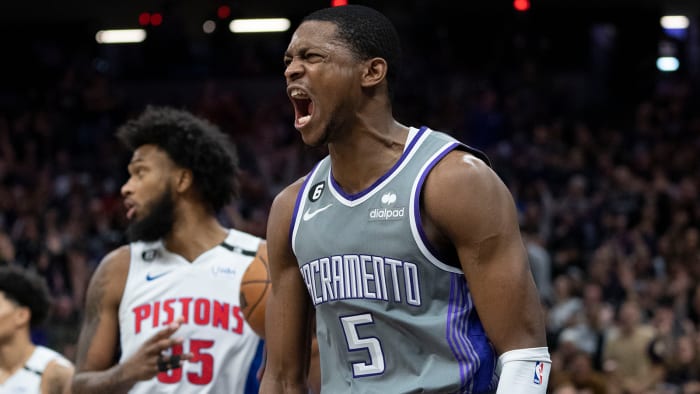 Sacramento Kings guard De'Aaron Fox celebrates after dunking the basketball against Detroit Pistons.